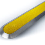 Tactilo ground surface indicator model G-CRB made of stainless steel, with yellow carborundum insert.